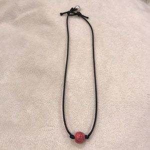 Choker necklace with a red ball